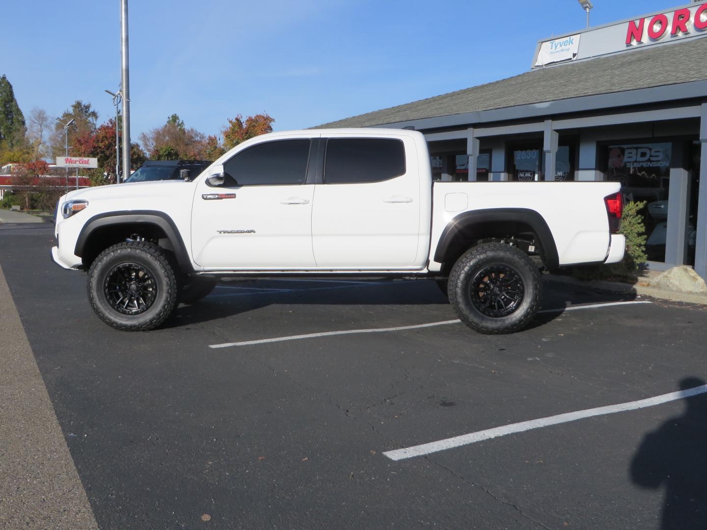 2019 White /black Toyota Tacoma TRD OFF-ROAD Double Cab (3TMAZ5CN4KM) with an 3.5L engine, automatic transmission, located at 2630 Grass Valley Highway, Auburn, CA, 95603, (530) 508-5100, 38.937893, -121.095482 - TRD Offroad 2WD sitting on Fox 2.5 remote reservoir DSC Coil-overs, Total Chaos upper control arms, Rigid Industries Dually side shooter leds, Fuel Rebel wheels, Nitto Ridge Grappler tires, and window tint. - Photo#7